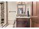 Bathroom with modern vanity, stone countertop, decorative backsplash, and shower-tub combo at 5390 S Geneva St, Englewood, CO 80111