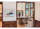 Open dining room with wood trim, chandelier, and large windows for natural light at 5390 S Geneva St, Englewood, CO 80111