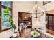 The dining area leads to the living room and features a large wood table at 5390 S Geneva St, Englewood, CO 80111