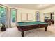 Game room offers a pool table with a window view and neutral carpeting at 5390 S Geneva St, Englewood, CO 80111