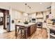 Large kitchen featuring a center island, granite countertops, stainless steel appliances, and custom cabinetry at 5390 S Geneva St, Englewood, CO 80111