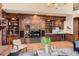 Living room boasts custom wood built-ins, a wet bar, and elegant decor at 5390 S Geneva St, Englewood, CO 80111