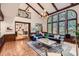 Open concept living room with tall ceilings, fireplace, and access to the kitchen at 5390 S Geneva St, Englewood, CO 80111
