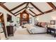 Main bedroom featuring vaulted ceilings, fireplace, and neutral carpet at 5390 S Geneva St, Englewood, CO 80111