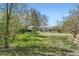 Expansive backyard with a lush lawn, featuring a storage shed and ample space for outdoor activities at 2022 S Clay St, Denver, CO 80219