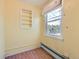 Bedroom featuring a built-in shelving unit and a window with natural light at 2022 S Clay St, Denver, CO 80219