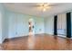 Bright living room featuring hardwood floors, a ceiling fan, and classic architectural details at 2022 S Clay St, Denver, CO 80219
