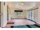 Living room featuring tile flooring, and a sliding door and large windows for ample light at 2022 S Clay St, Denver, CO 80219