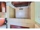 Vintage tiled utility sink in kitchen area with cabinets and fixtures at 2022 S Clay St, Denver, CO 80219