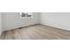 Bright bedroom with light wood-look flooring at 144 Wooten Ave, Brighton, CO 80601