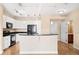 Bright kitchen features white cabinetry, granite countertops, and stainless-steel appliances at 9019 E Panorama Cir # D211, Centennial, CO 80112