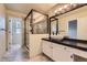 Well-lit bathroom features tiled floors, vessel sink, and glass enclosed shower at 2902 W Long Cir # B, Littleton, CO 80120