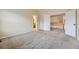 Main bedroom featuring wall-to-wall carpet and access to the en-suite bath and loft at 2902 W Long Cir # B, Littleton, CO 80120