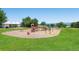 Community playground with slides and play equipment on a sunny day at 2902 W Long Cir # B, Littleton, CO 80120