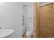 Clean basement bathroom with shower stall, toilet and sink at 3998 Haddon Rd, Denver, CO 80205