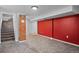 Spacious finished basement with neutral walls and carpet at 3998 Haddon Rd, Denver, CO 80205