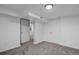 Finished basement with multiple rooms and closets at 3998 Haddon Rd, Denver, CO 80205