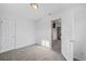 Bright bedroom with carpet and access to hallway at 3998 Haddon Rd, Denver, CO 80205