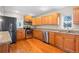 Updated kitchen with wood cabinets and granite counters at 3998 Haddon Rd, Denver, CO 80205