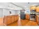 Eat-in kitchen with island and stainless steel appliances at 3998 Haddon Rd, Denver, CO 80205