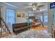 Bright bedroom with a cozy bunk bed, futon sofa, and colorful decor, perfect for or guests at 5610 Brentwood St, Arvada, CO 80002