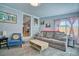 Comfortable living room with soft carpeting, a cozy sofa, and stylish decor at 5610 Brentwood St, Arvada, CO 80002