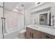 Modern bathroom with a shower-tub combination and wood-tone vanity at 4426 Utica St, Denver, CO 80212