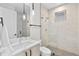 Modern bathroom featuring a glass-enclosed shower, stylish vanity with marble countertop, and elegant pendant lighting at 4426 Utica St, Denver, CO 80212