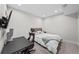 Cozy bedroom with gaming desk, swivel chair, and comfortable bed at 4426 Utica St, Denver, CO 80212