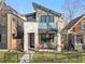 Contemporary two-story home featuring a stone facade and modern architectural details at 4426 Utica St, Denver, CO 80212