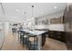 Bright kitchen featuring a marble island, pendant lighting, and an open layout to the living area at 4426 Utica St, Denver, CO 80212