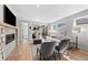 Cozy living room with a stone fireplace, hardwood floors, and comfortable seating arrangement at 4426 Utica St, Denver, CO 80212