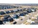 Real estate aerial view of a property with green lawn amid similar homes in a planned community at 26818 E 1St Pl, Aurora, CO 80018