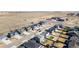 Wide aerial view of a home in a residential area with neat yards and a school nearby at 26818 E 1St Pl, Aurora, CO 80018
