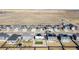 Aerial view of a home with solar panels and a well-maintained, compact backyard at 26818 E 1St Pl, Aurora, CO 80018