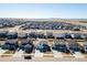 Aerial view showcasing a home in a planned community with multiple gray and brown single-Gathering residences at 26818 E 1St Pl, Aurora, CO 80018