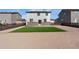 Spacious backyard featuring artificial turf and rock landscaping with a wooden fence at 26818 E 1St Pl, Aurora, CO 80018