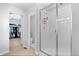 Bright bathroom featuring a walk-in shower and access to a large walk-in closet at 26818 E 1St Pl, Aurora, CO 80018