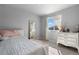 Cozy bedroom with a comfortable bed, a full length mirror, and a dresser at 26818 E 1St Pl, Aurora, CO 80018