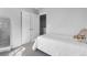 Simple bedroom featuring a comfortable bed, a full-length mirror, and closet space at 26818 E 1St Pl, Aurora, CO 80018