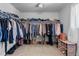 Spacious walk-in closet with ample storage, shelving, and hanging space for organized clothing at 26818 E 1St Pl, Aurora, CO 80018