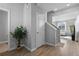 Bright entryway featuring hardwood floors, neutral walls, and a staircase leading to the upper level at 26818 E 1St Pl, Aurora, CO 80018