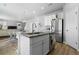 Modern kitchen with stainless steel appliances, granite countertops, and an island with seating at 26818 E 1St Pl, Aurora, CO 80018