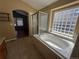 Bathroom showcases a soaking tub, glass shower and unique glass block window at 20148 E Dartmouth Dr, Aurora, CO 80013