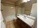 Full bathroom featuring neutral tile, a shower-tub combo, and a vanity with countertop at 20148 E Dartmouth Dr, Aurora, CO 80013
