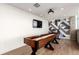Game room with a shuffleboard table, decorative wall art, and modern lighting at 1700 Bassett St # 1102, Denver, CO 80202