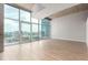 Bright living space with floor-to-ceiling windows showcasing city views and access to a balcony at 1700 Bassett St # 1102, Denver, CO 80202