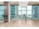 Bright living space with floor-to-ceiling windows showcasing city views and an in-wall bar at 1700 Bassett St # 1102, Denver, CO 80202