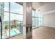 Bright living space with floor-to-ceiling windows showcasing city views and an in-wall bar at 1700 Bassett St # 1102, Denver, CO 80202