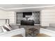 Comfortable lounge area with stylish seating, modern decor, and a large flat-screen TV at 1700 Bassett St # 1102, Denver, CO 80202